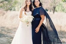 47 a navy maxi dress with a fitting silhouette, a sash and a sheer capelet on top are an amazing outfit for a formal wedding