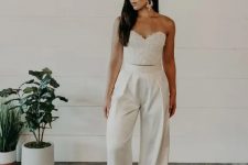 48 an embellished corset bodice plua high waisted wideleg pants and statement earrings are a lovely combo for a bridal shower