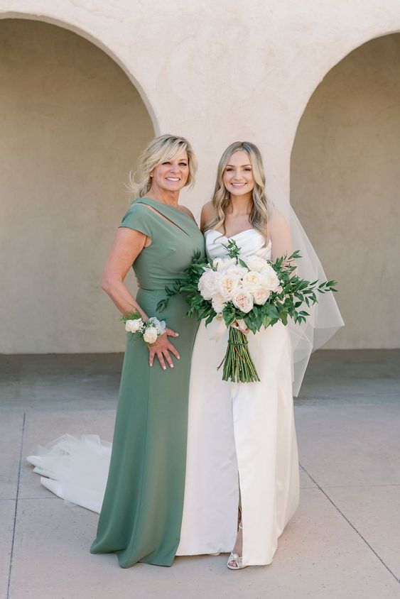 a stylish green maxi dress with a cutout and one shoulder neckline is a cool idea for a spring or summer mother of the bride look