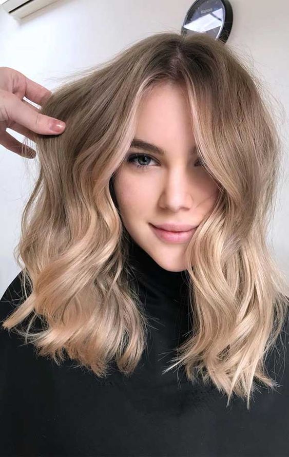A beautiful low maintenance shoulder length hairstyle with darker and brighter shades, shiny soft blonde is amazing