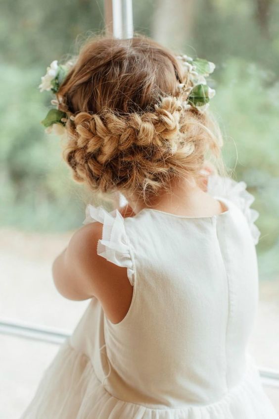 a beautiful messy double braided halo, with fresh blooms and greenery is a great idea for a flower girl with long hair