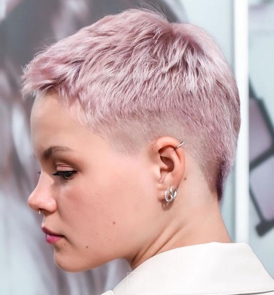 a beautiful pastel pink short pixie cut with an undercut is always an edgy idea, and its color makes it look softer