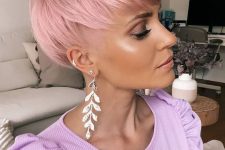 a beautiful pink long pixie with fringe and layers looks dreamy and very charming