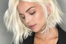 a beautiful platinum blonde long bob with a lot of volume and a bit of wavy texture is a lovely idea to rock