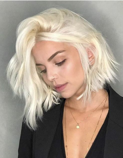 a beautiful platinum blonde long bob with a lot of volume and a bit of wavy texture is a lovely idea to rock