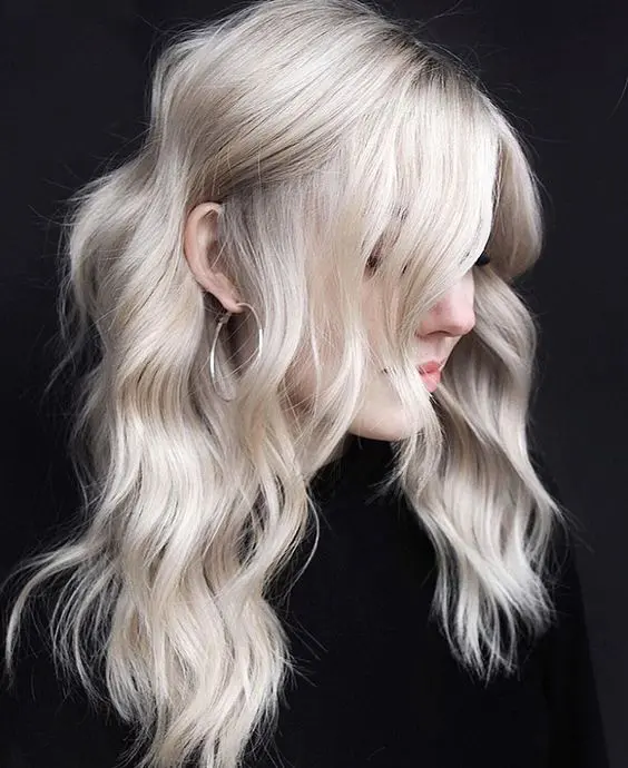 a beautiful platinum long hairstyle with waves looks delicate, chic and stylish and catches an eye with a lovely shade