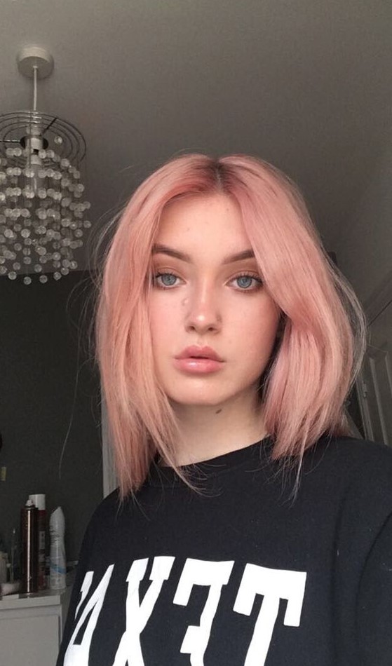 a beautiful warm pastel strawberry blonde with a darker root and much texture looks awesome