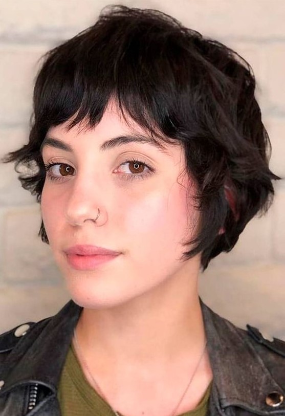 a black wavy bixie with bottleneck bangs is a lovely idea for those who have naturally curly hair
