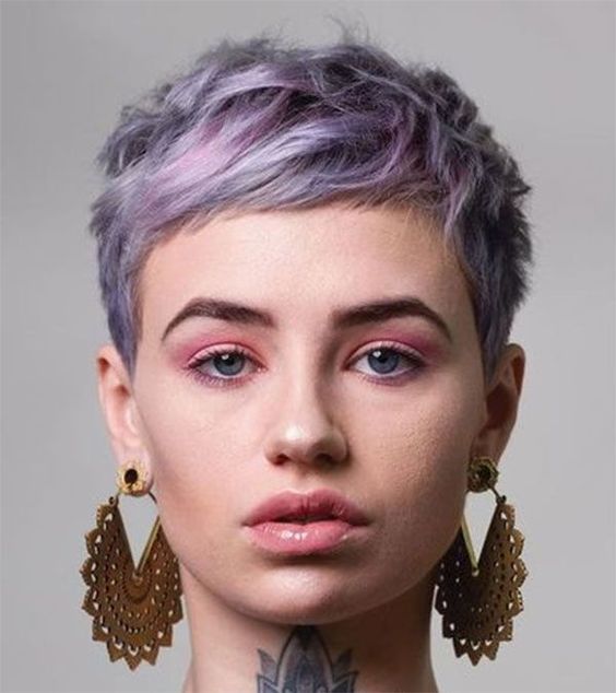 A blue and lilac long layered and messy pixie cut with volume is a very chic and eye catching idea