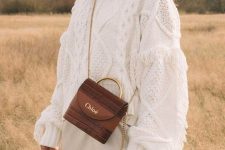 a boho bridal shower look with a slip skirt, a white boho sweater with fringe and a brown bag with gold detailing