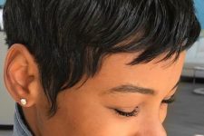 a bold and eye-catchy black pixie with a lot of volume and a bit of bangs is a lovely and edgy solution