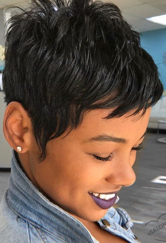 A bold and eye catchy black pixie with a lot of volume and a bit of bangs is a lovely and edgy solution