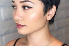 a bold black pixie cut with wispy bangs and a bit of messy waves is a lovely idea, it looks casual and very up-to-date