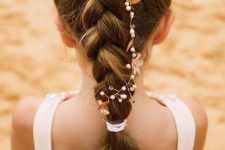 a braid with a hair vine is a simple and long-lasting solution for a flower girl, it looks cute and chic