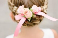 a braided updo with a halo and fresh pink roses is a cool and cute idea for a flower girl look, it’s cute and chic