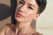 a classyc black pixie haircut with short sides and long top plus some volume is a beautiful and chic idea to rock