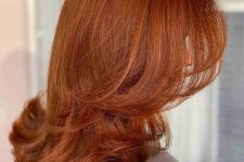 a cool and bright copper butterfly haircut on medium length hair, with curled ends is a lovely idea that looks chic