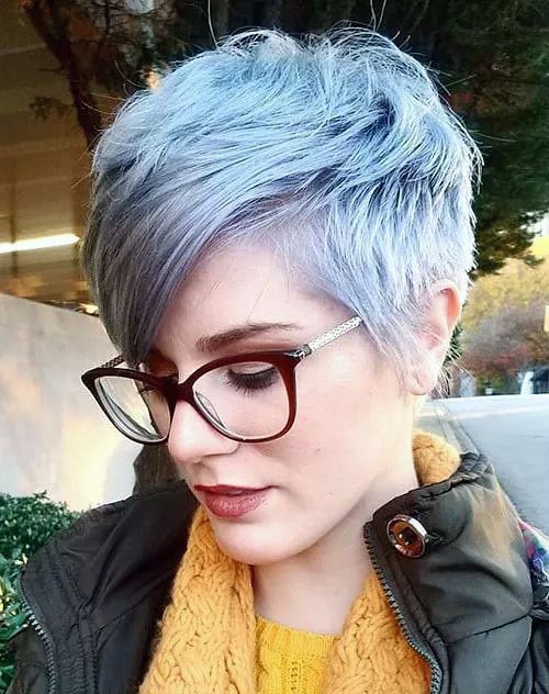 a delicate pastel blue textured long pixie with long side bangs is a cool idea if you love blue colors