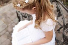 a half updo with a braided halo and a bump on top, with waves down is a cool idea for a flower girl, add fabric blooms