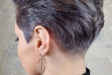 a lilac long pixie looks super bold due to the shaved sides, and its styling can be very versatile