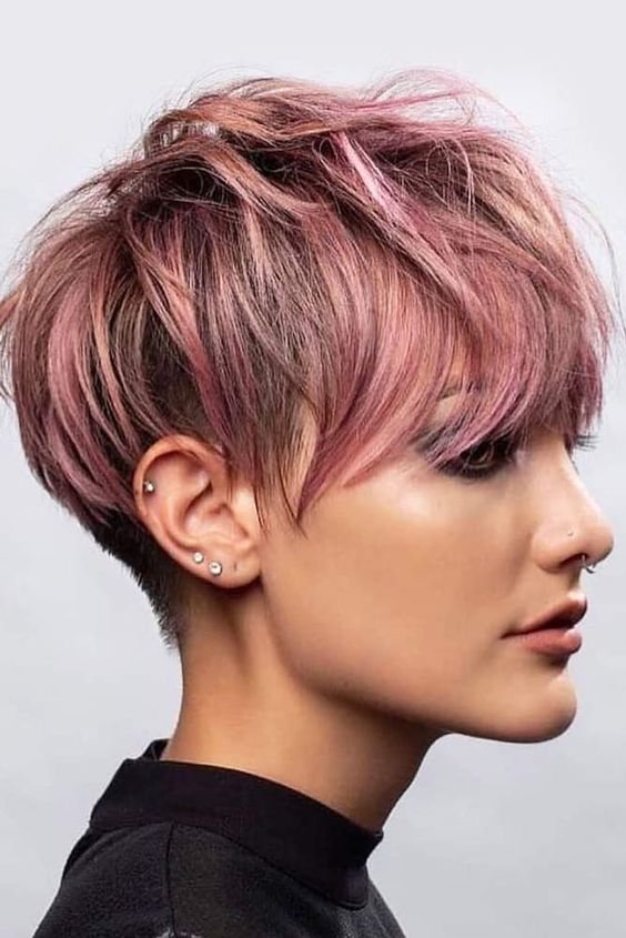 a long pink pixie haircut with messy layers and outgrown bangs is a cool idea with a soft touch of color