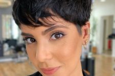 a long shaggy messy textural black pixie haircut with a lot of volume is amazing for rocking it right now