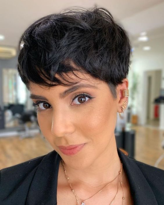 a long shaggy messy textural black pixie haircut with a lot of volume is amazing for rocking it right now