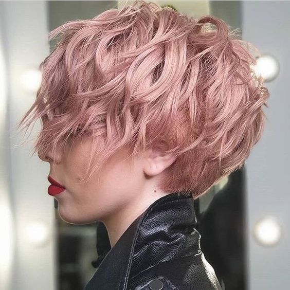 a long wavy pink pixie with long bangs  and volume is a lovely and cool idea for a soft look, waves and the color will flatter