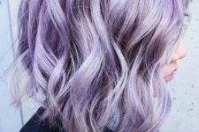 a lovely asymmetrical long wavy bob with purple and lilac hair and waves is a stylish and eye-catchy idea