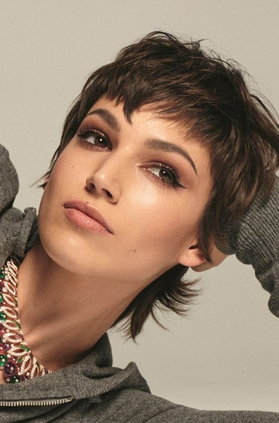 a lovely short brunette mullet with bangs and a bit of volume is a super cool and chic idea