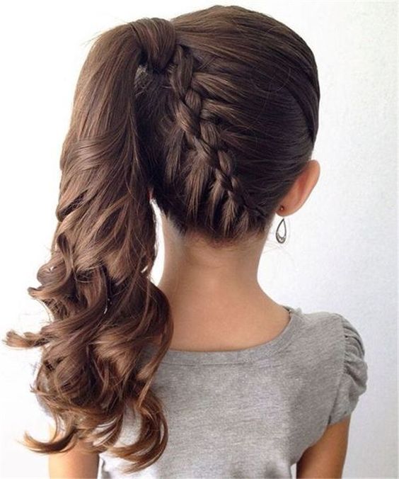 a lovely side ponytail with a braid and waves is a cool and bold solution for a flower girl with long hair