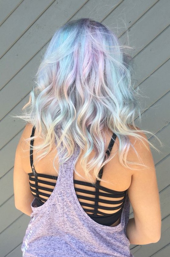 A medium length mermaid hairstyle with light blue, green and liac and messy waves will turn you into a mermaid at once