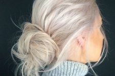 a messy low bun in platinum blonde, with a bump on top and a bit of messy touches is a cool idea for every day