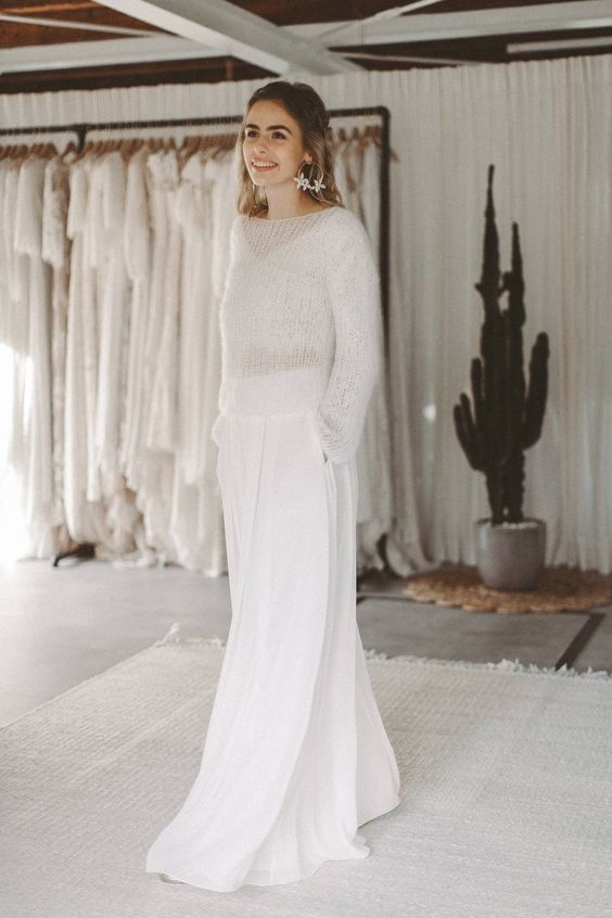 A modern bride to be look with a top, a sheer sweater on top and wideleg pants with pockets is a cool solution