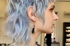 a pale blue short mullet with dimension and waves is a catchy and bold idea that looks rock-style