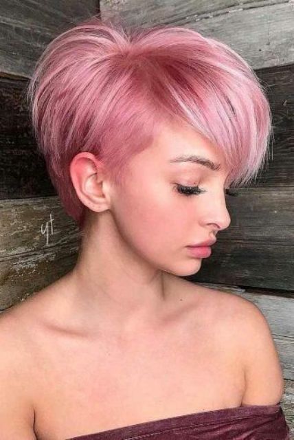 a pastel pink long pixie bob with a lot of volume and texture is amazing, it looks very feminine