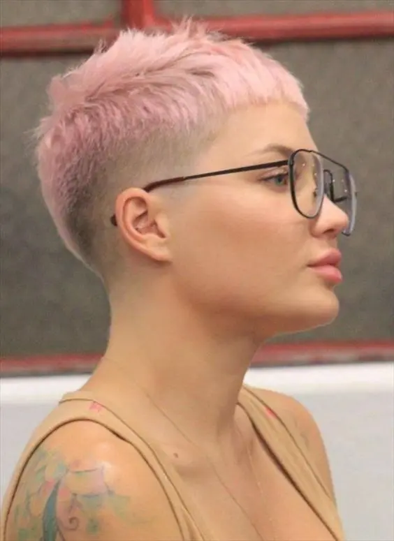 a pastel pixie haircut with an undercut and baby bangs is a very edgy and very bold idea