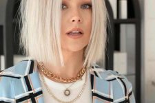 a platinum blonde texture long bob with a bit of volume is a stylish and catchy idea to rock