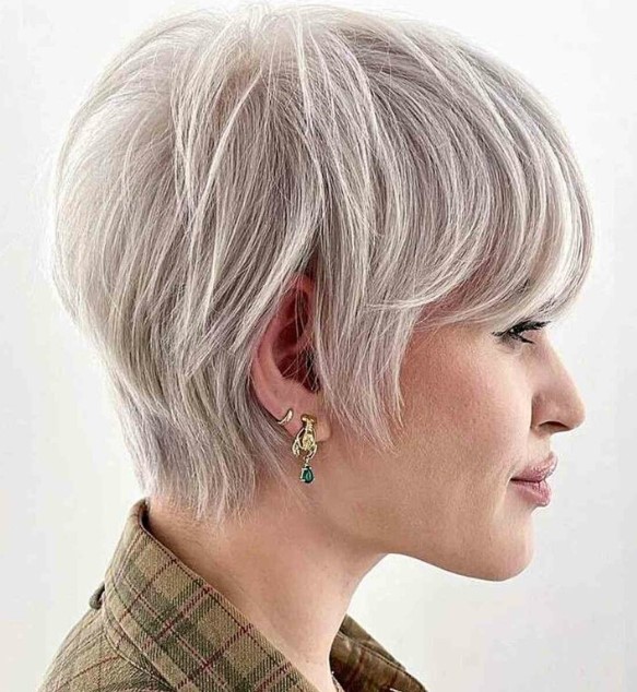 A platinum toned layered long pixie cut requires only a blow dry for a beautiful and stylish look