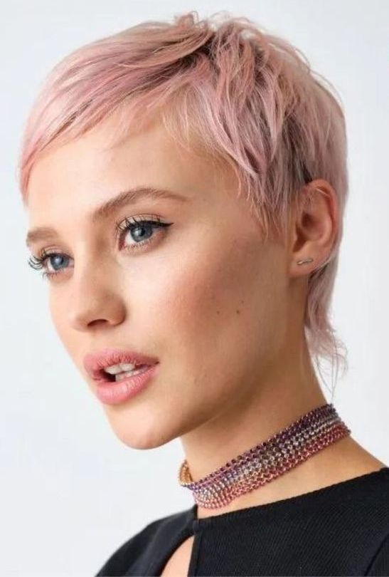 a pretty pink pixie cut with a bit of texture is a perfect idea to frame the face and accent the eyes