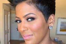 a sassy black pixie haircut styled up, with a lot of volume, is a bold and daring idea for some special occasion