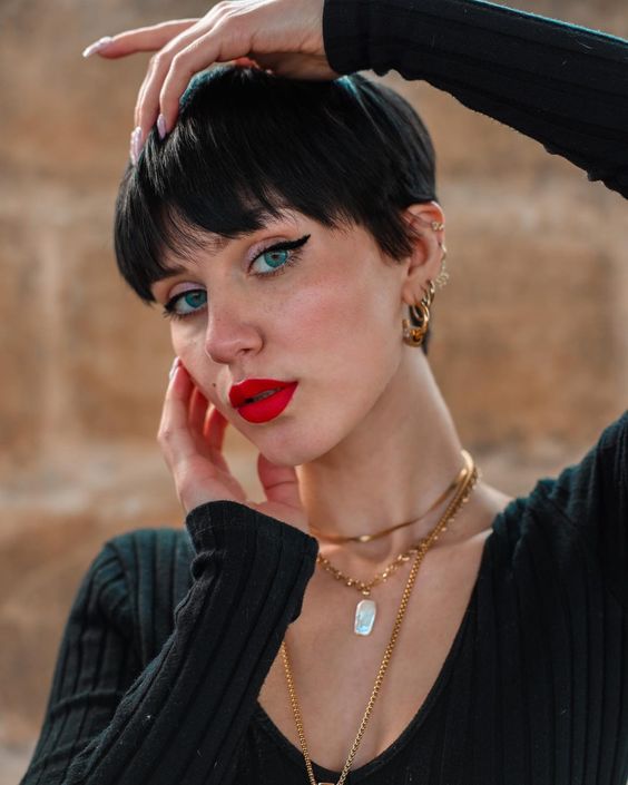 a shaggy black pixie haircut with wispy bangs and straight hair is a lovely idea, it looks very up-to-date