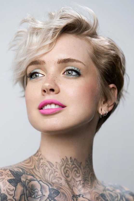 a short blonde pixie haircut with waves, a lot of volume and side part is a very cool and fresh idea to rock