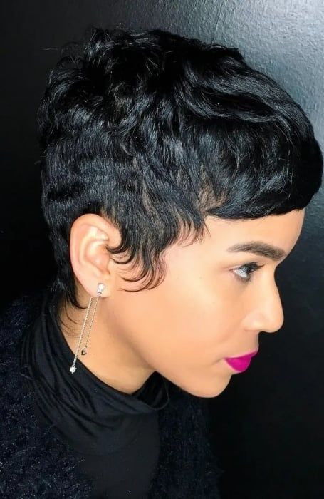 a short yet wavy pixie with shiny black hair and wavy sides is a cool solution if you want something short and really daring