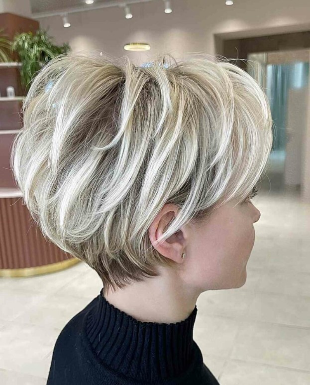 a super cool icy blonde layered pixie bob with darker root is a cool idea to get volume, movement and texture at the same time