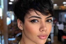 a textured black pixie haircut with long hair and a lot of volume is a lovely and catchy solution
