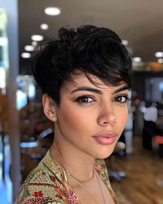 a textured black pixie haircut with long hair and a lot of volume is a lovely and catchy solution