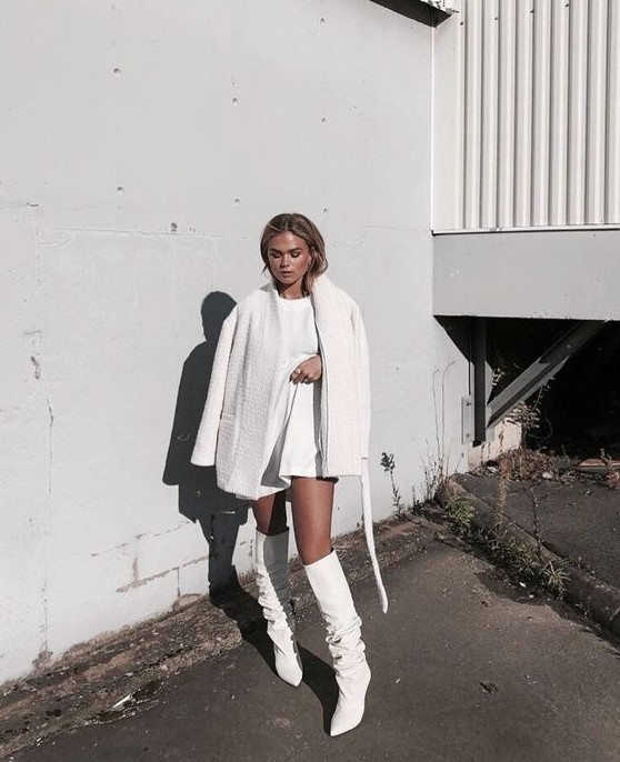 a total white look with a mini dress, a faux fur coat and tall boots is a minimal and stylish idea