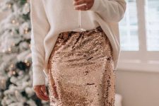 a white oversized jumper, a rose gold sequin midi pencil skirt and statement earrings for holiday bridal showers