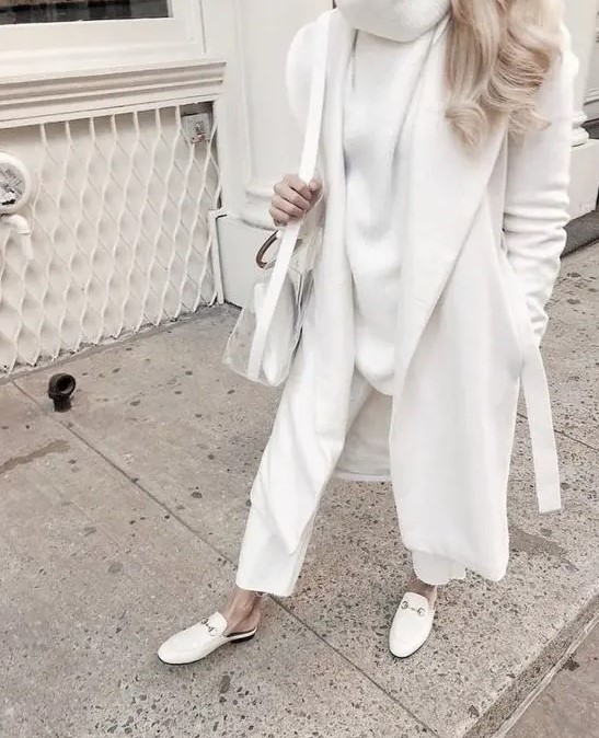 a white sweater, white pants, a coat, mules and a semi sheer bag for a lovely fall or winter look